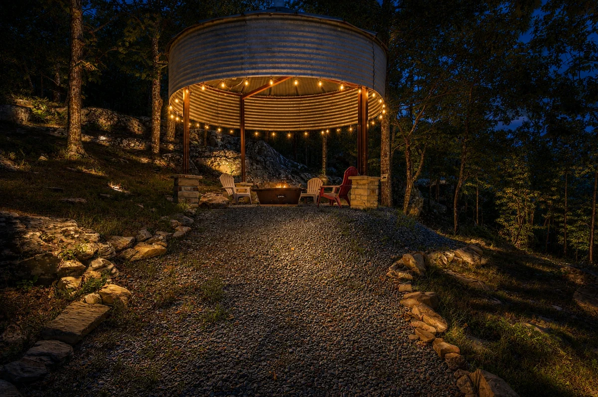 Lighted woodland gazebo at Moonshine Mountain after dusk