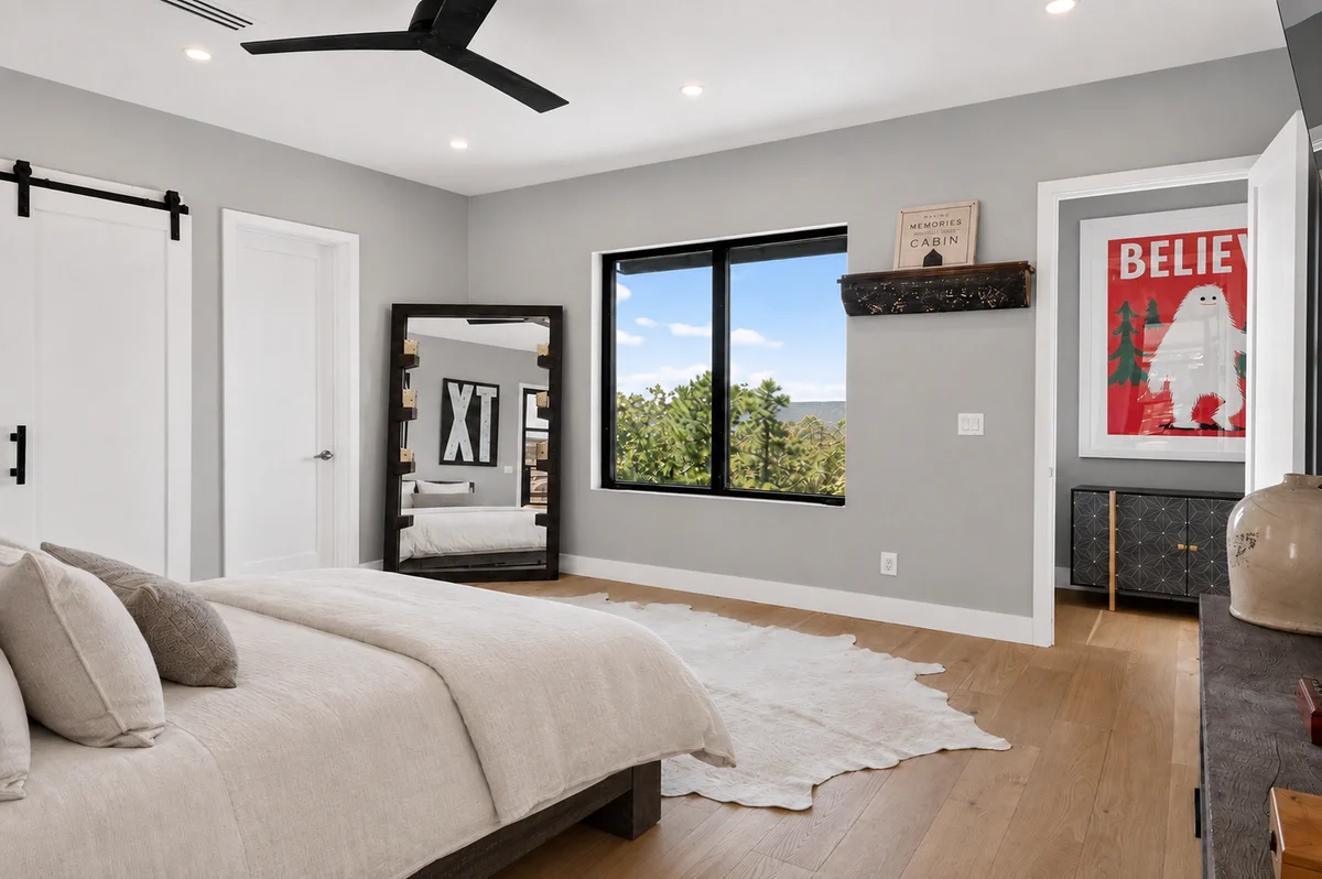 Bright primary suite with wooded views at 10 Moonshine Drive